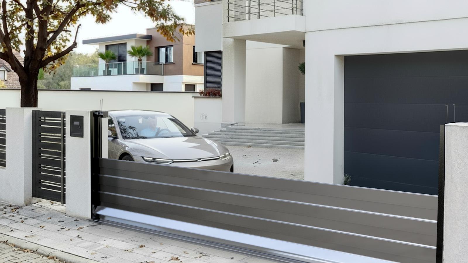 HiddenGate installed at a modern home, gate rising as a car approaches