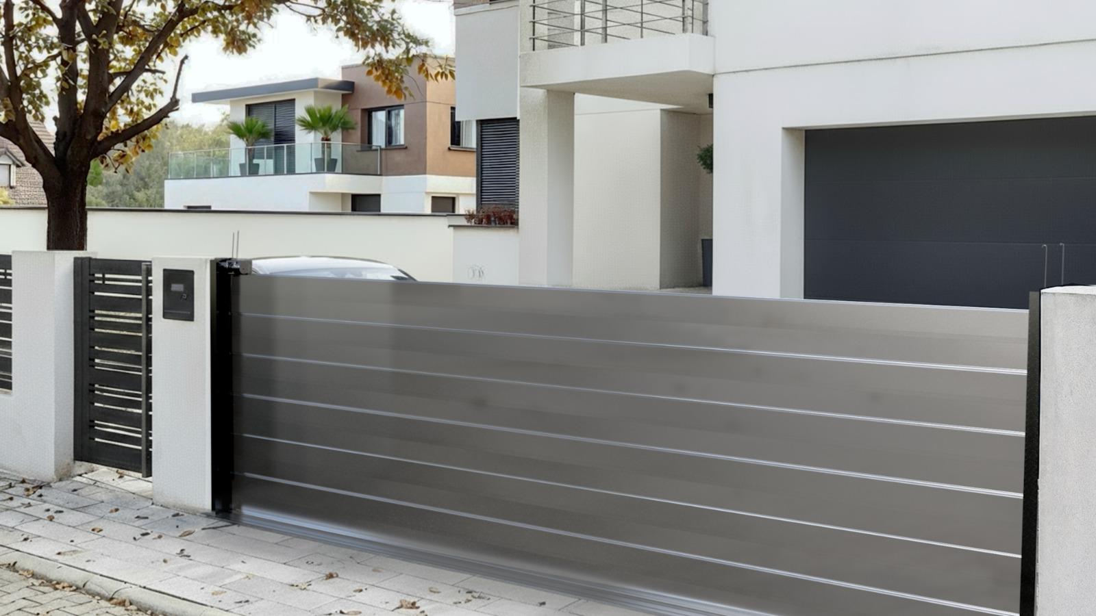 Aluminium HiddenGate sliding gate across a modern driveway
